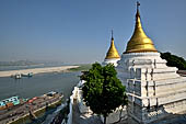 Myanmar - Sagaing, Shwe-kyet-kay a pagoda on a steep bank of the Irrawaddy river close to the two parallel bridges linking Sagaing and Amarapura. 